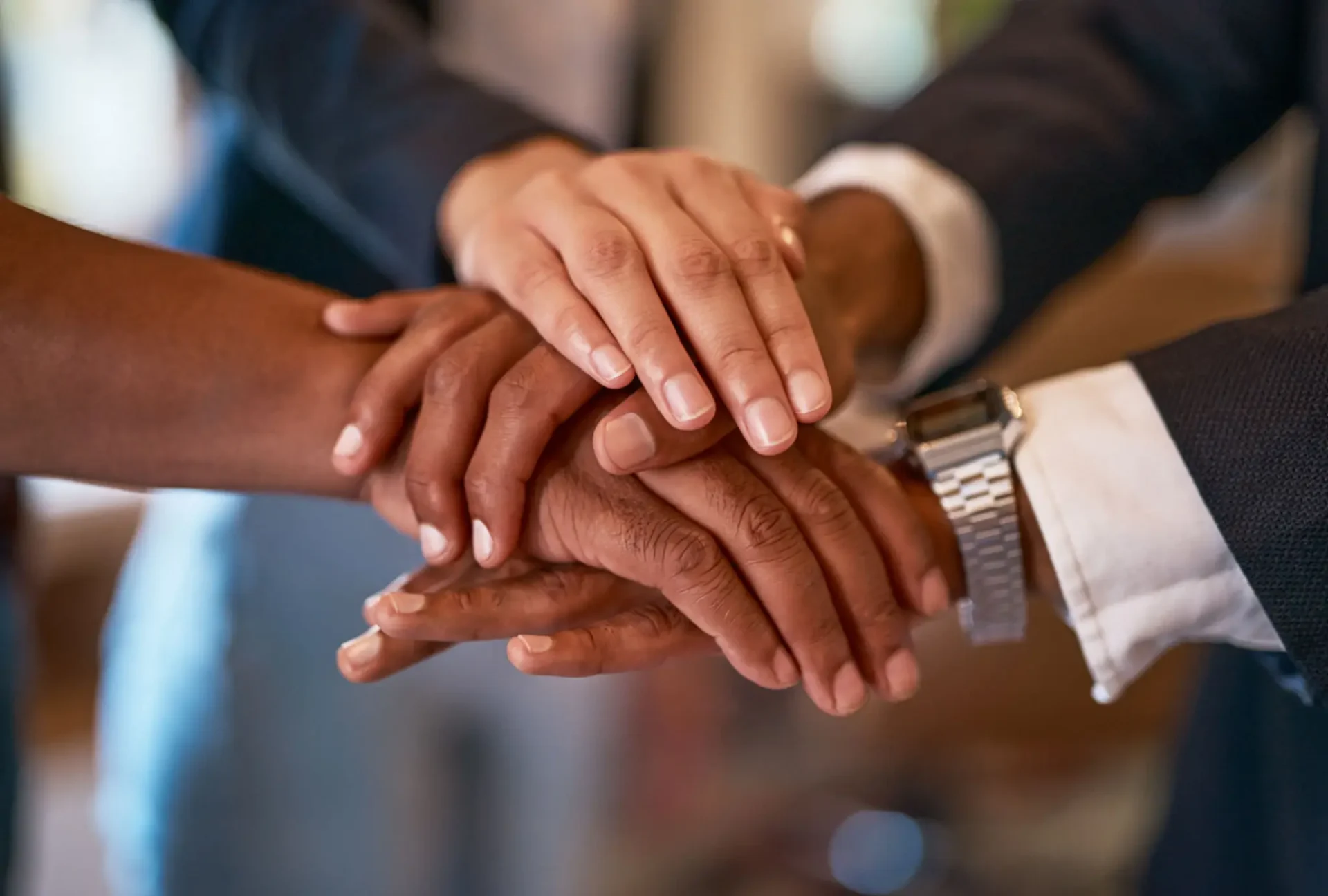 Business team showing unity with hands